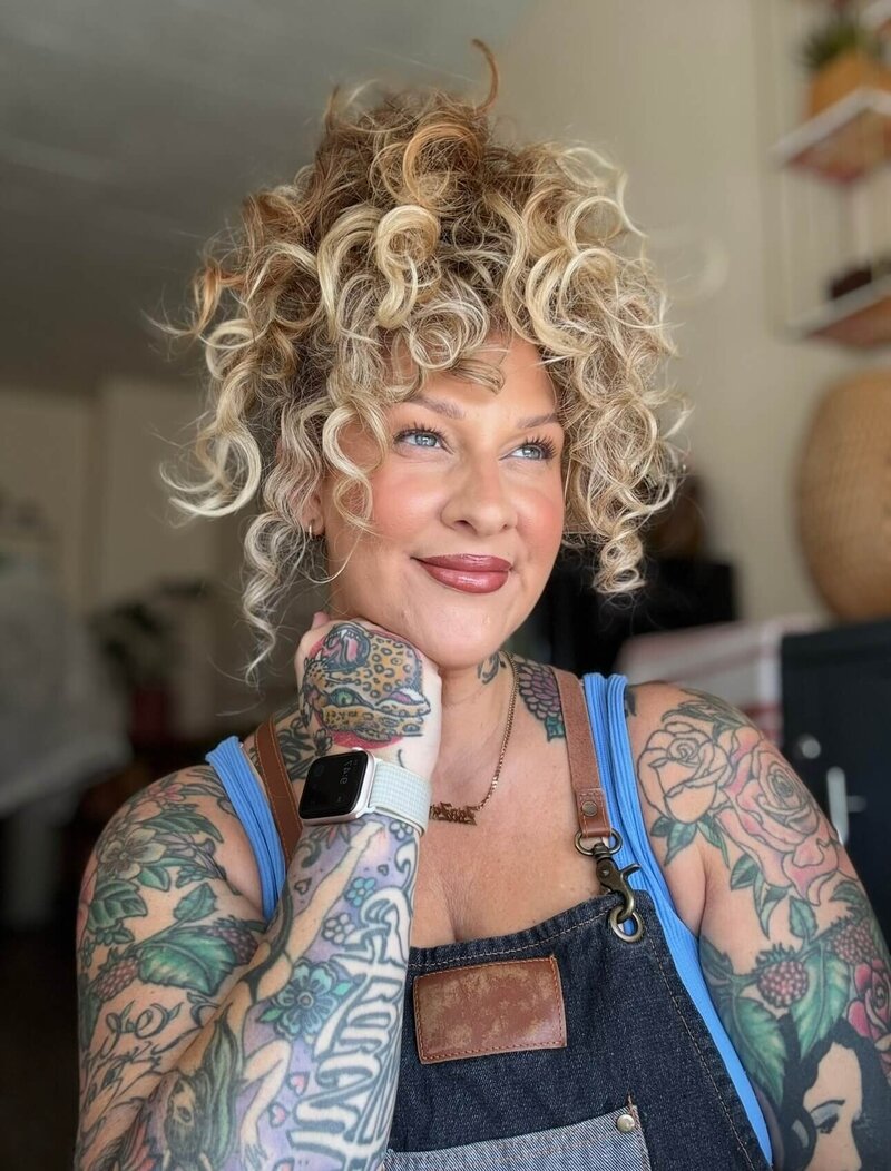 Libby an esthetician in eugene oregon and owner of Looks with Libby smiles at the camera.