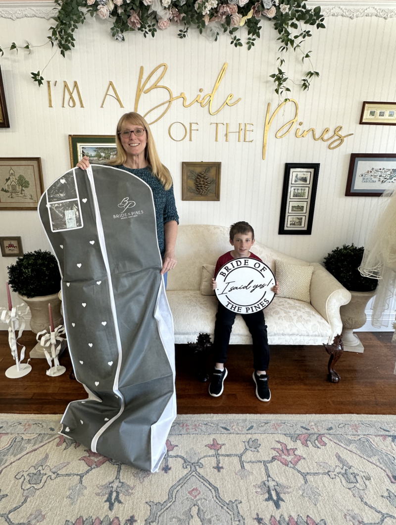 bride taking her dream wedding dress home from bride of the pines in aberdeen nc