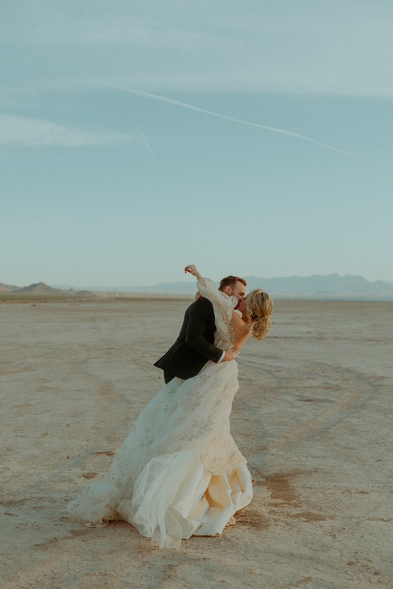 woman and man wedding posting on lakebed