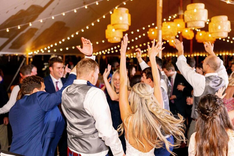 Bride and Groom at their wedding reception dancing  in a Sperry tent in Wisconsin.