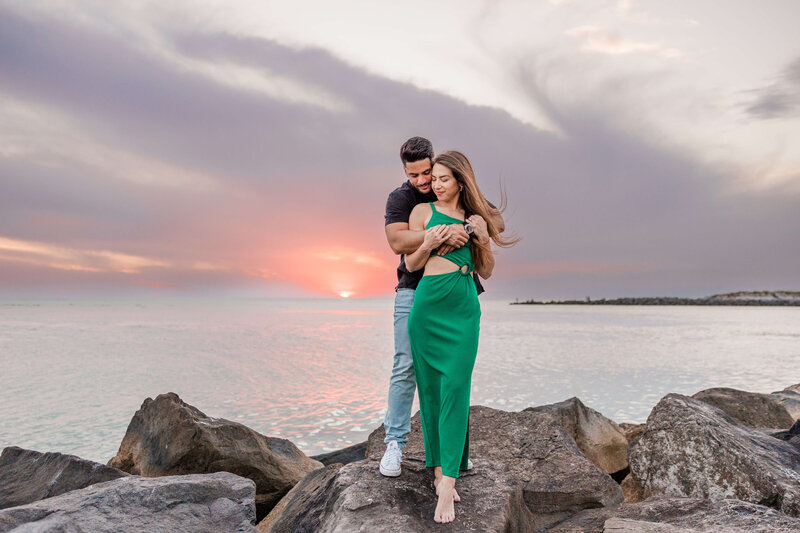 couple gets engagement photos taken at sunset on St. Pete Beach