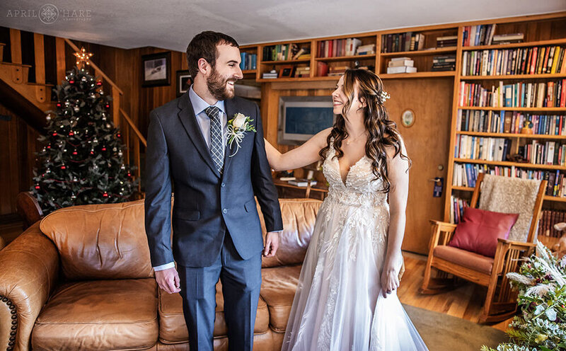 Bride and Groom First Look in the Living Room at Romantic Riversong Inn Estes Park CO
