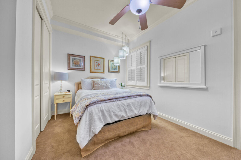 bedroom with queen bed and night stand