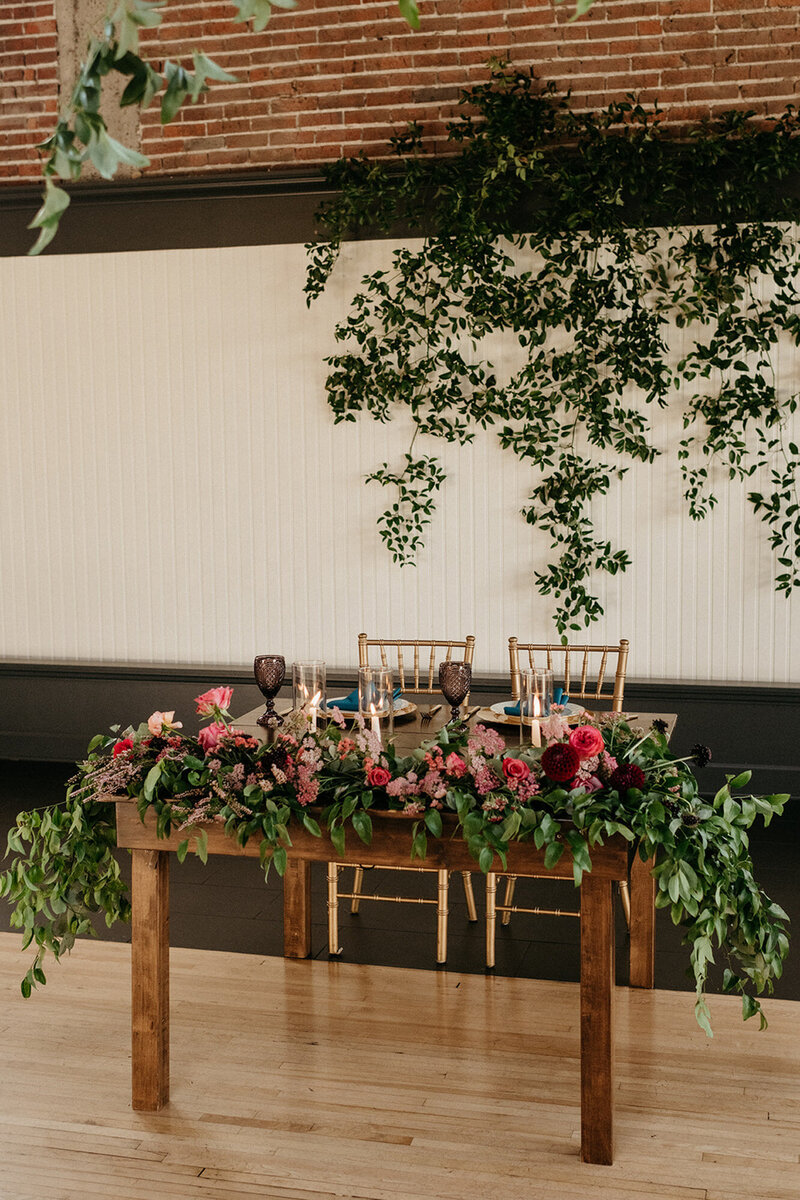 Elegant table setup with florals for the bride and groom at The Evergreen