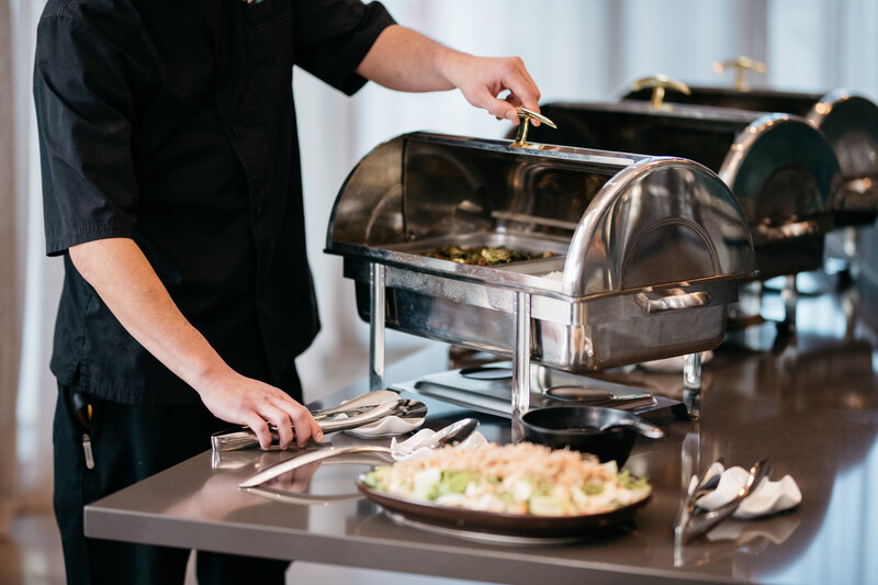 Chef setting up buffet