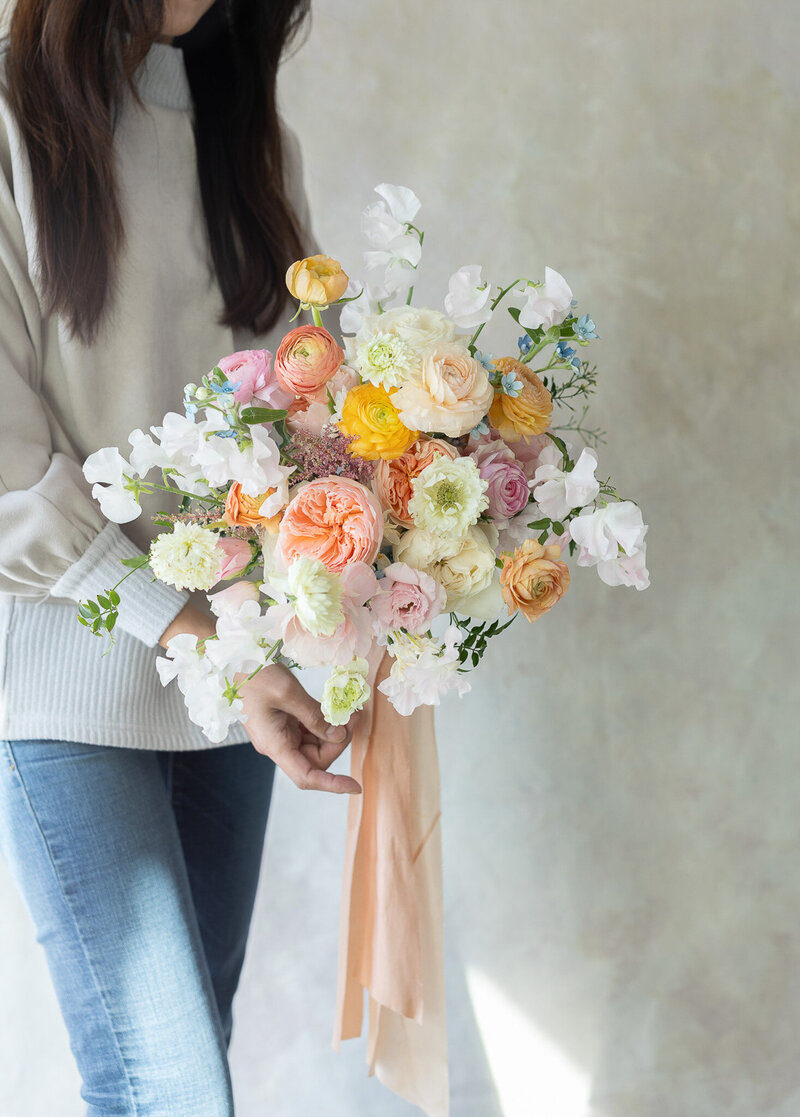Spring wedding bouquet using StemSlider bouquet-making tool with peach, blush, white blooms by Koko Flora