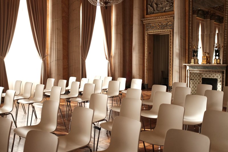 Chairs arranged in a beautiful room for a speaking session