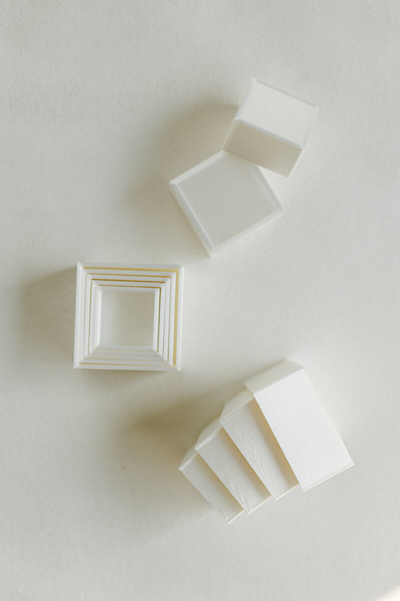 Square blocks used to add height and interest to flat lay designs