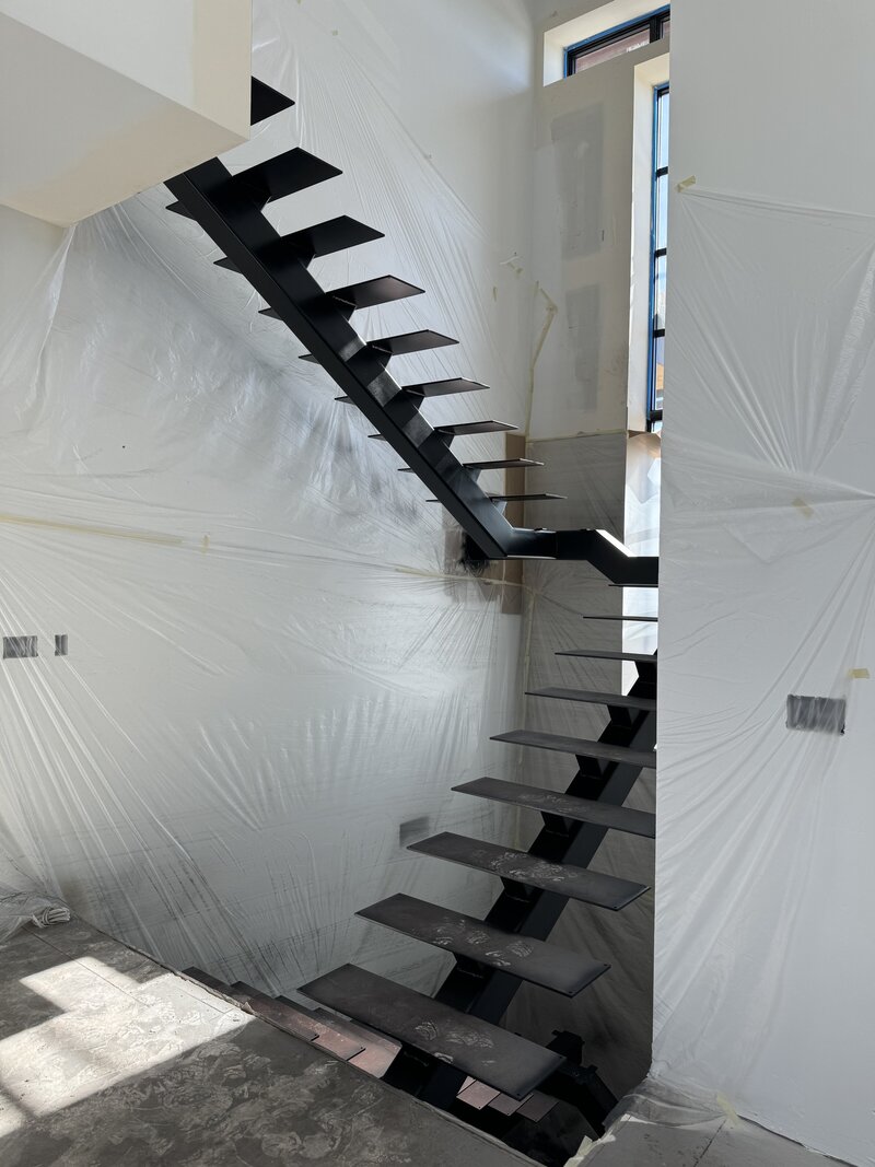 Building process of an interior staircase by Eagle Idaho luxury custom home builder designer Thompson Homes
