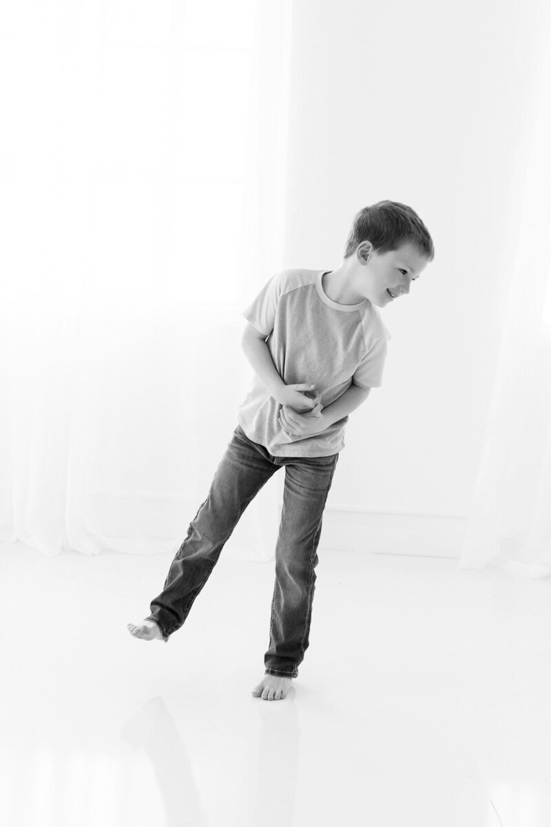 Boy standing in Boise photography studio.