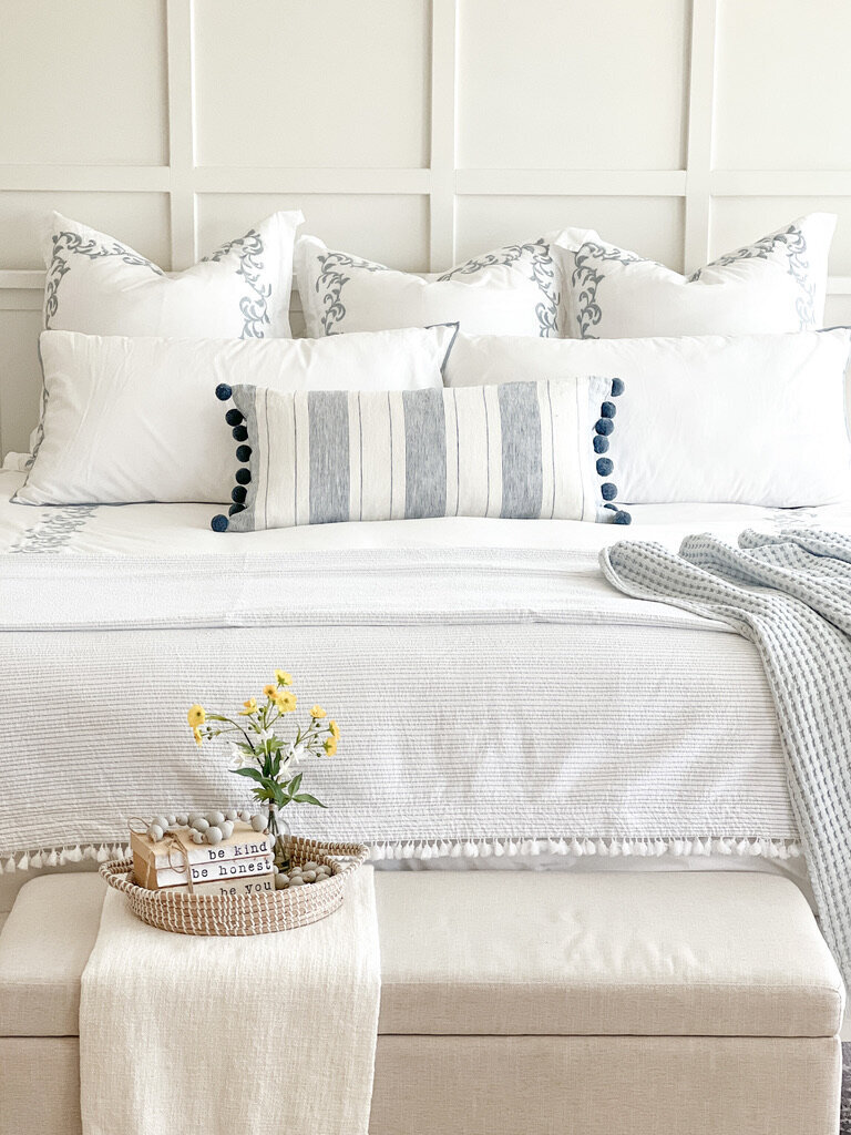 girls bedroom with board and batten sherwin williams pure white and vanity with mirror and queen size bed with a pathos plant