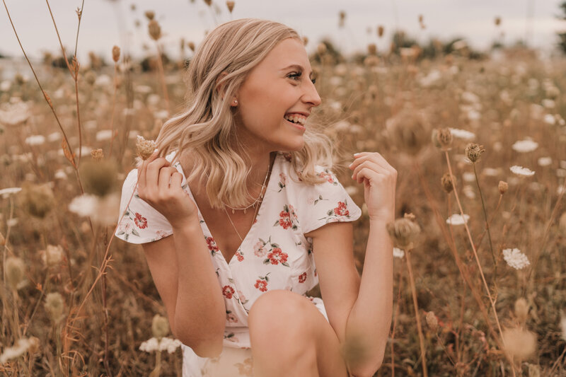 Girl smiling in flowers