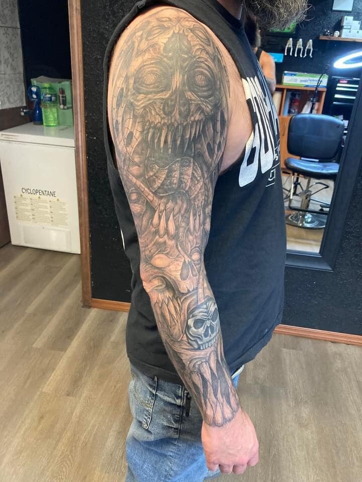 Dark Art Collective tattoo full sleeve