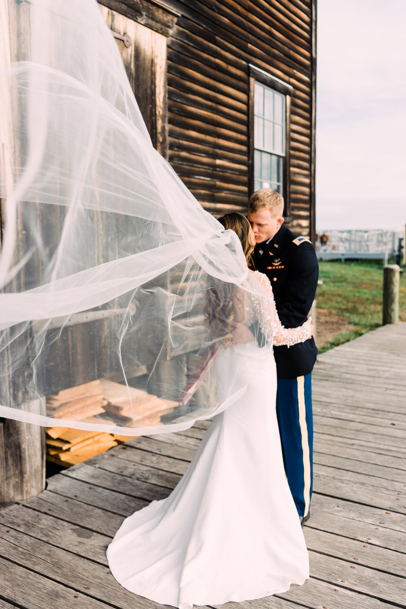 Photo of couple with veil in the wind