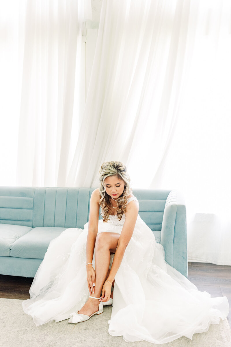 bride putting on her shoes