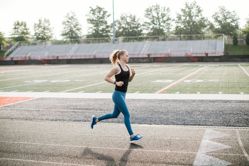 woman running on track