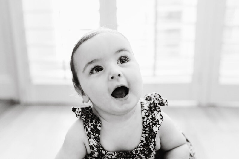 black and white photo of a baby girl