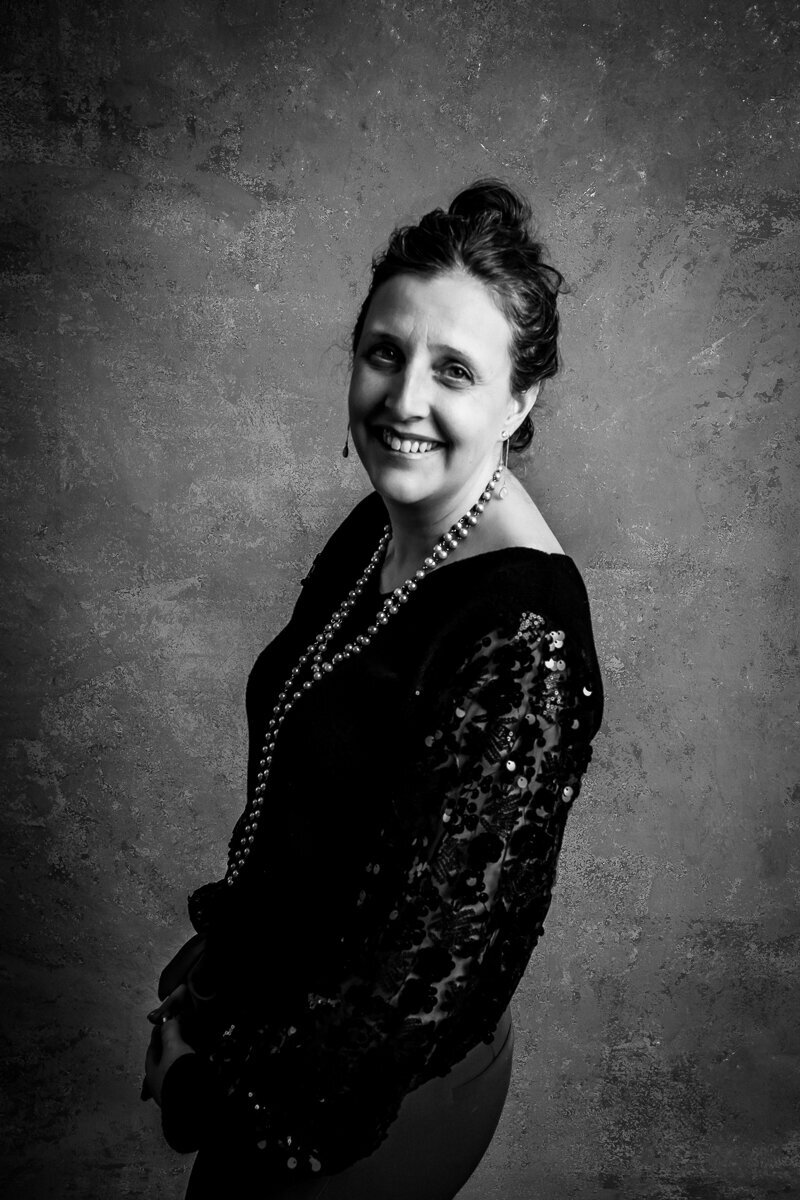 Classic black and white Portrait of Heidi smiling at the camera