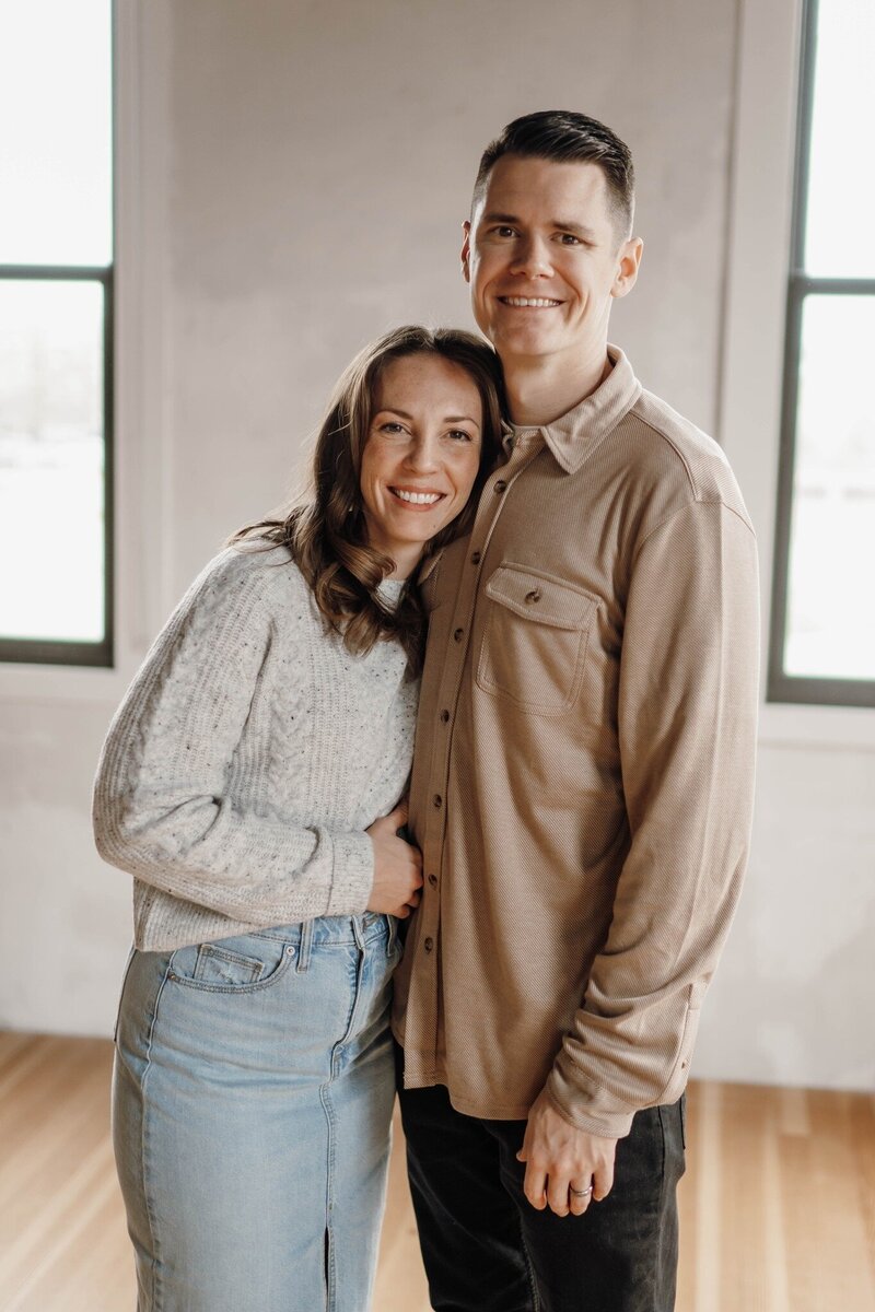 A portrait of a man and woman smiling