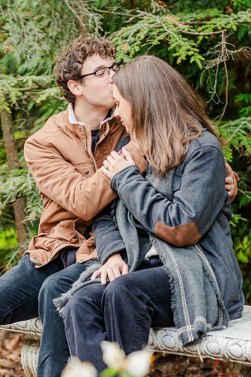 guy-kissing-girls-forehead-in-mackinac-island-flower-garden