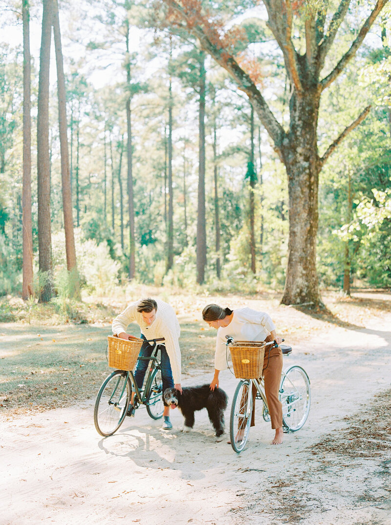 Autumn engagement session with cozy fashion, bicycles with baskets and a sheepadoodle puppy