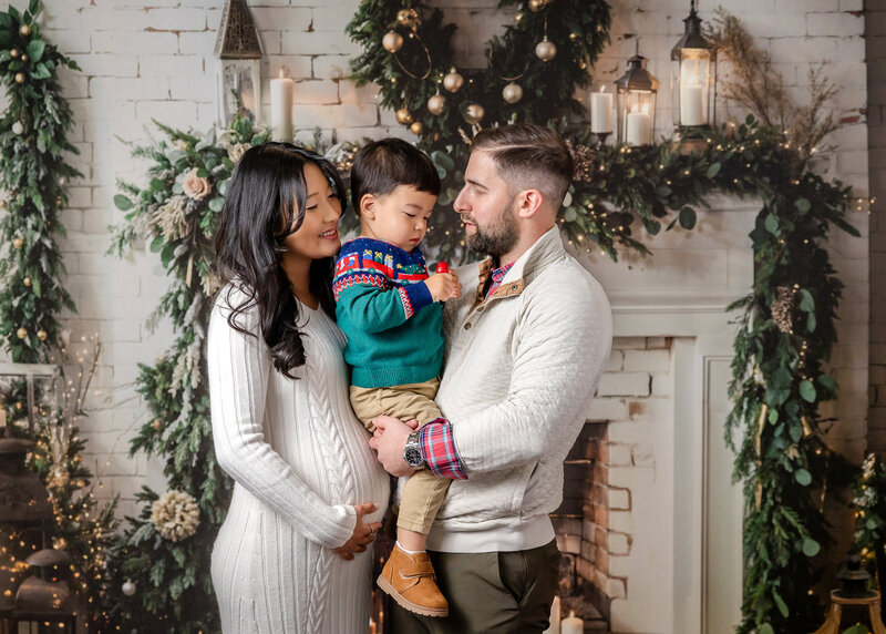 Holiday portrait of hugging family at Allison Reilly's Union County, NJ photo studio.