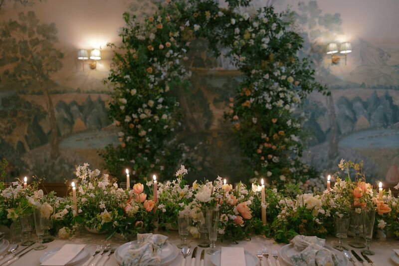 An abundant wedding floral arch with spring flowers