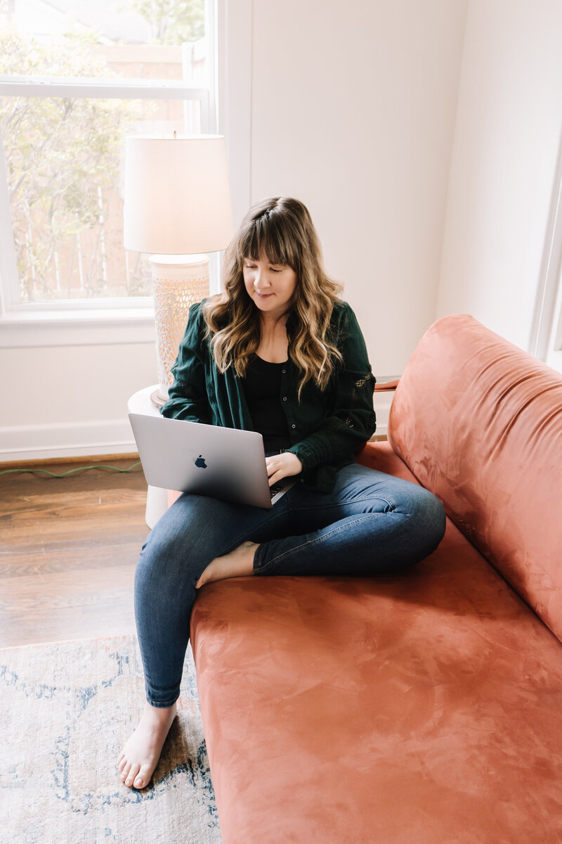 Woman on her laptop on the couch