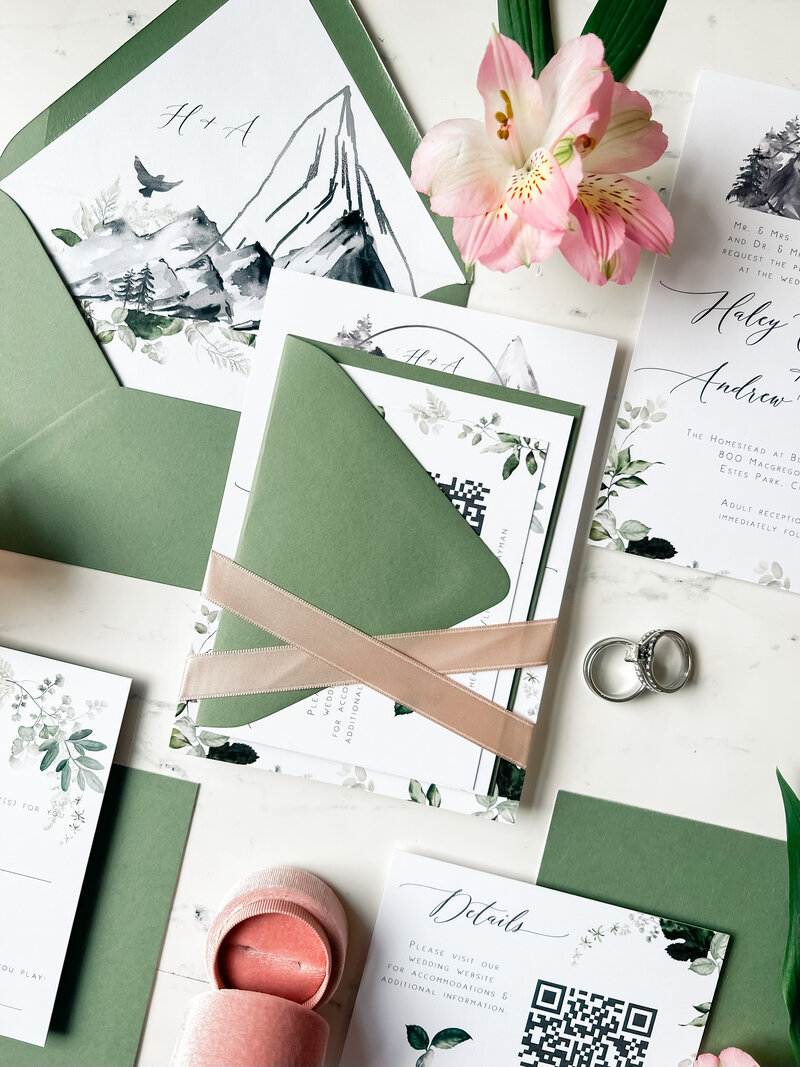 Green mountain wedding invitation with ribbon