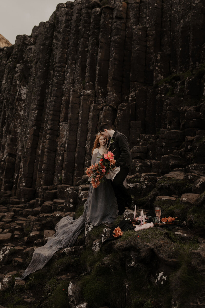 bride and groom eloping at giants causeway