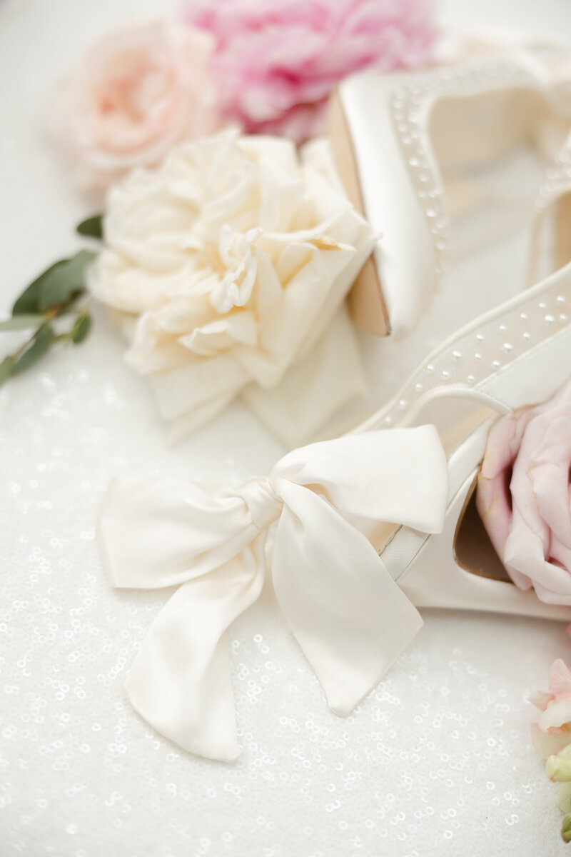 close up photo of bow on bella belle bridal shoes