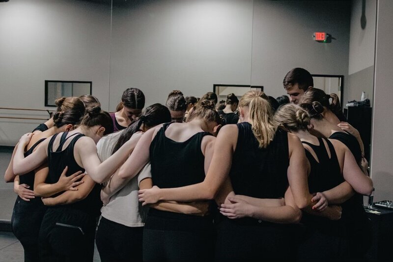 Dancers pray after class in Texas