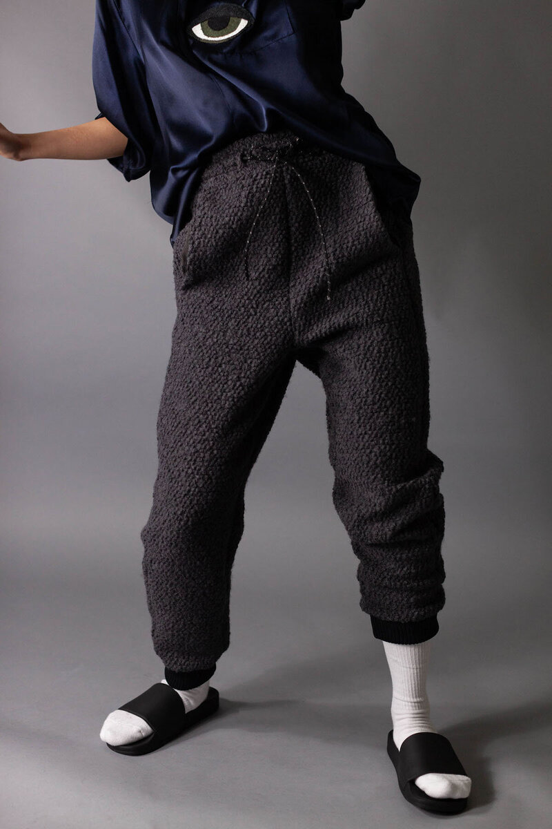 Model dancing in custom grey sweatpants