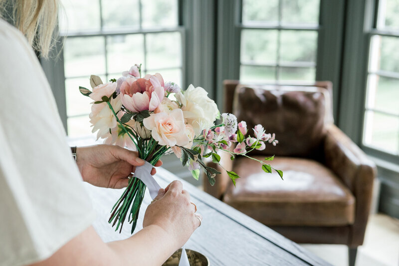 wrapping a paper flower bouquet in silk ribbon