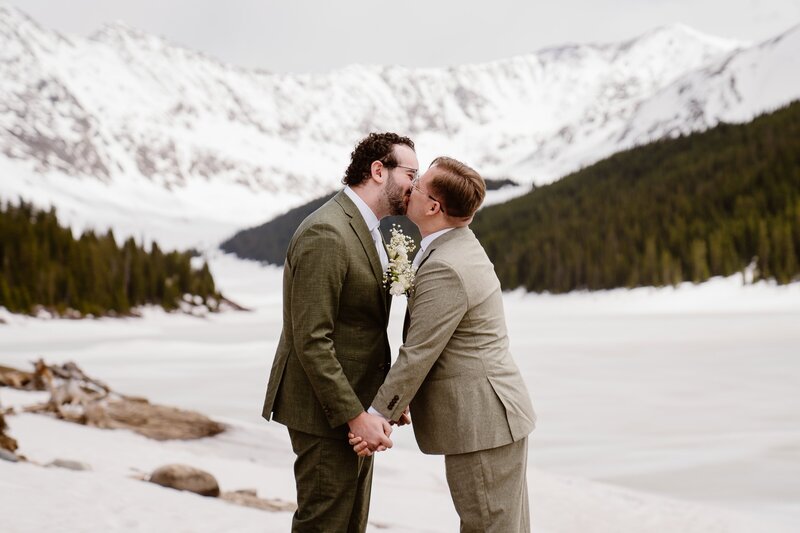 Gay couple kisses during their elopement in Leadville, Colorado