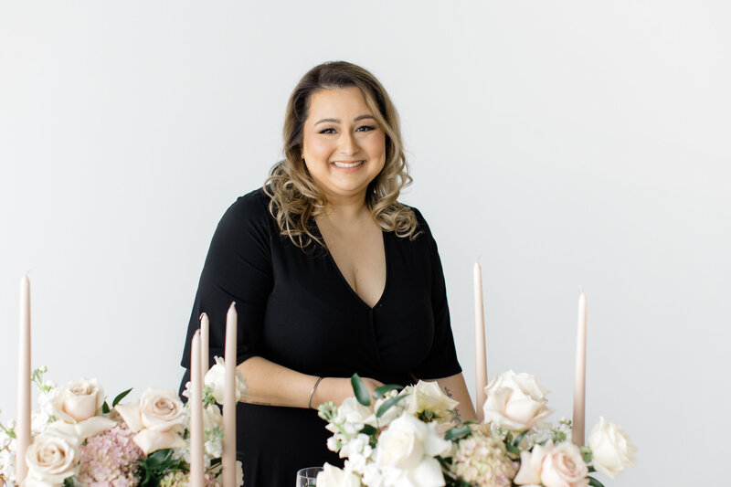 Canadian wedding planner wearing all black and smiling into the camera