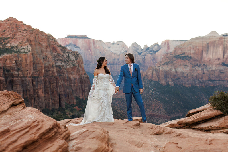 This couple hiked out to the overlook after their intimate Zion National Park elopement.