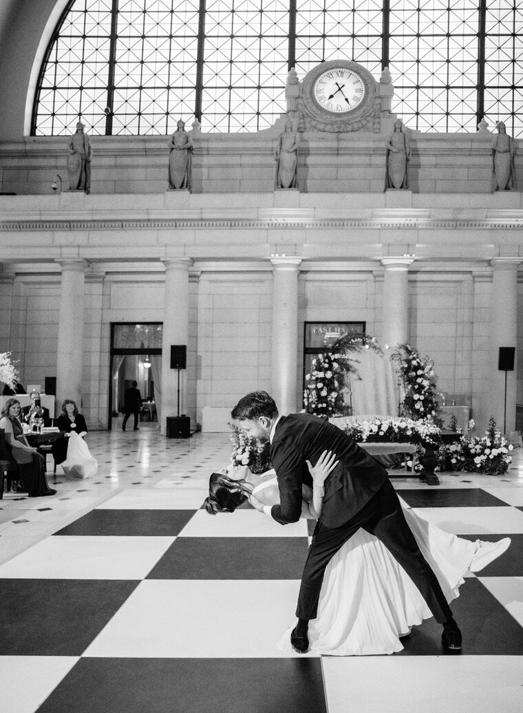 Engaged couple dancing a dip on their wedding day