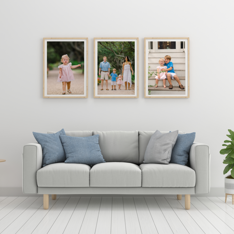 Living room with three pictures of family holding hands and hugging