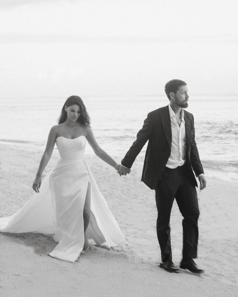 Newlyweds sharing a serene first dance on a beach, encapsulating LIMCO's essence of natural, modern, and connected dance experiences.