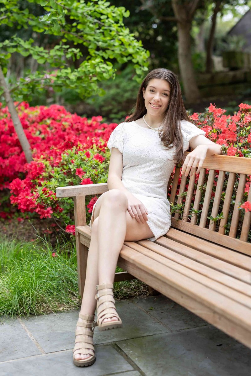 High school graduation photography for a senior girl wearing a white elegant dress, part of the Senior Photography Portfolio captured in Dallas.