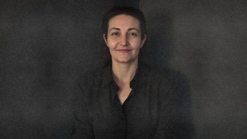 Portrait of Chantell, the designer, having a meeting in an office