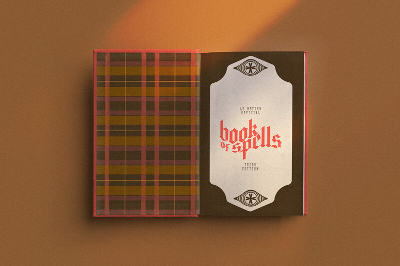 spell book mockup with le metier colors and custom plaid pattern