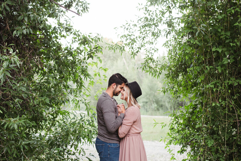 couple hugging during outdoor engagement session in Tennessee