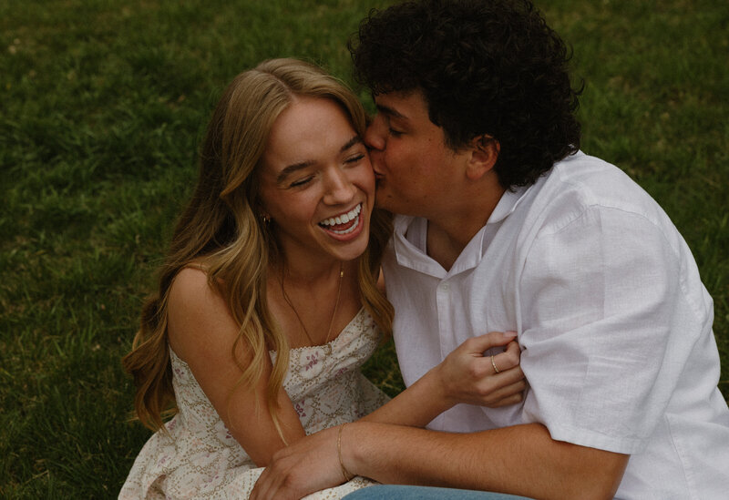 Baby announcement in Idaho Falls ID.  The soon to be mom is lying her head on her husband's lap.