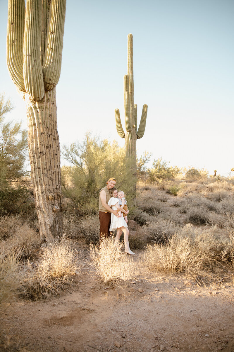 Family posing by cactus