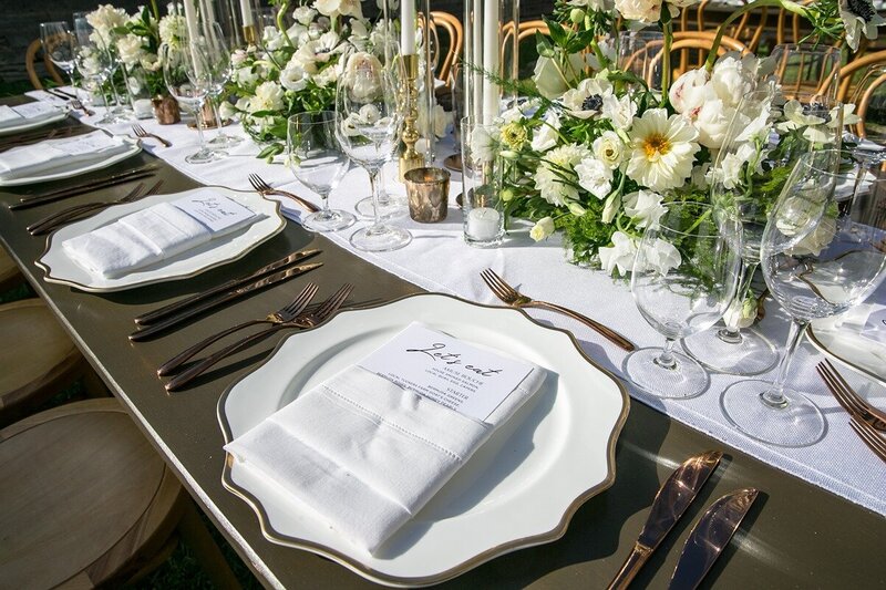 Scallop edge plates with napkin tucked in