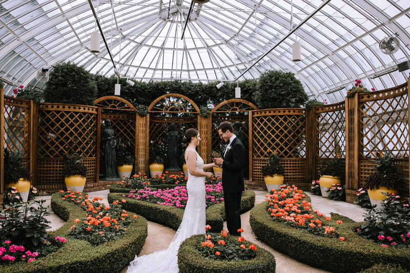 Bride and groom exchanging private vows at Phipps Conservatory. 