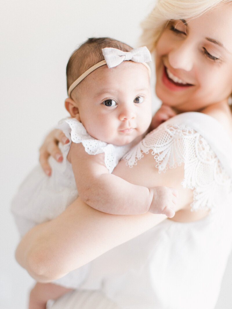 Mom and three month old baby girl in BHLDN dress.