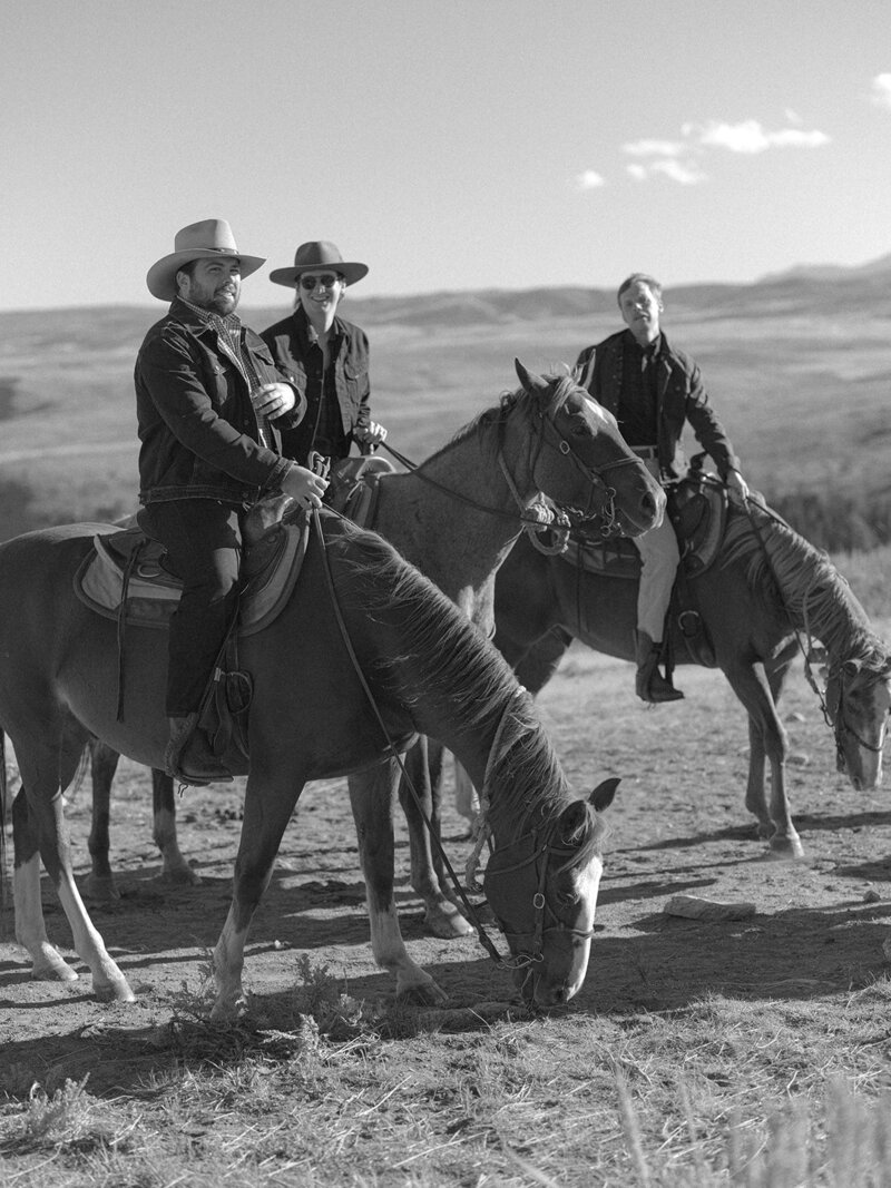 guests on horses at a ranch wedding in Wyoming